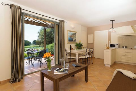 Light-filled living and dining space with direct access to the terrace — Provence at your doorstep.
