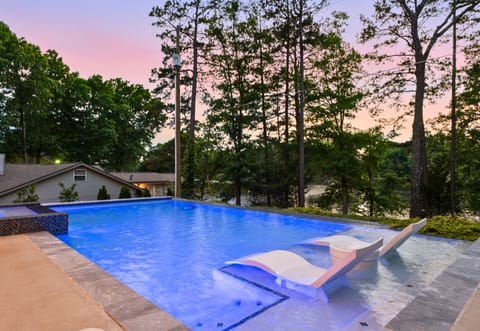 Lounge poolside while taking in the peaceful lake views and colorful evening skies reflected across the water.