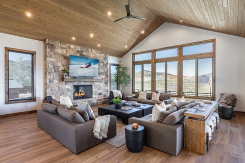 Grand living room · stone fireplace · Wasatch views
