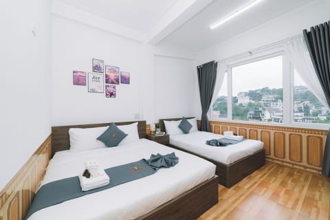 Deluxe Quadruple Room, City View | Iron/ironing board, free WiFi
