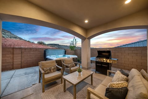 Your private outdoor oasis awaits. Relax under the covered patio with plush seating, a BBQ grill, and the hot tub just steps away as the Southern Utah sky lights up behind you.
