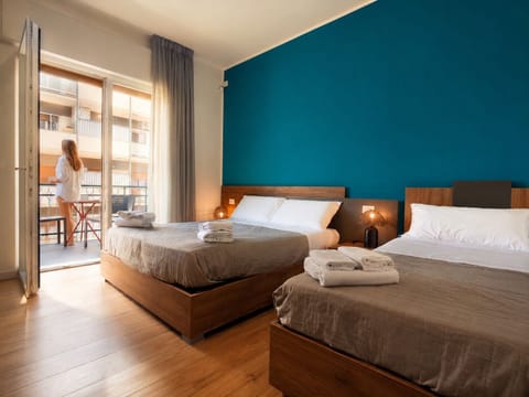Luxury Triple Room, Balcony | Minibar, in-room safe, desk, laptop workspace