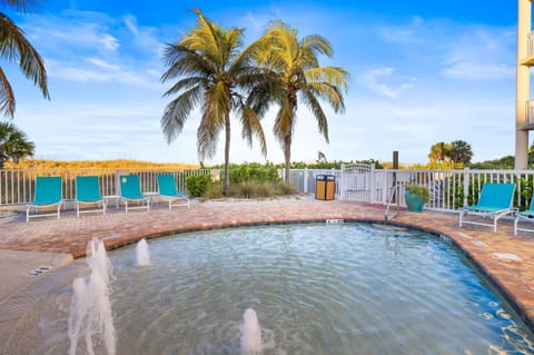 Dive into relaxation by the poolside, surrounded by swaying palms and the sound of splashing water.