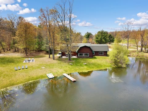 Aerial view of our home, dock, and paddle boat from the pond.