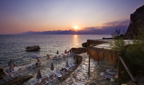 On the beach, sun loungers, beach umbrellas, beach towels