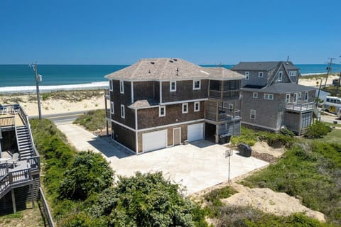 Spacious beach house with ocean views, balconies, and steps to the sand