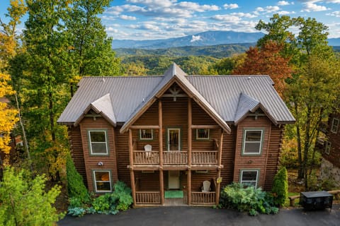 Luxury Smoky Mountain cabin exterior with panoramic mountain views, spacious multi-level decks, private wooded setting, and peaceful Sevierville getaway near Gatlinburg and Pigeon Forge.