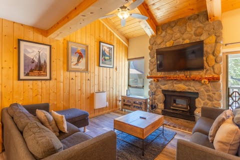 Cabin style living room w/ vaulted ceilings