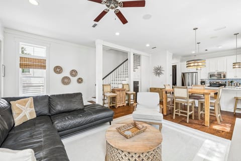 You'll love how this bright, open-plan space flows naturally from living to dining to kitchen—perfect for gathering, cooking, and relaxing together under the warm glow of natural light.