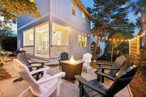 Gather around the fire pit on comfortable Adirondack chairs, surrounded by palms and string lights—perfect for unwinding after a beach day or sharing stories under the stars.