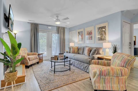 Gather together in the spacious living room, featuring plenty of comfortable seating for your entire group.