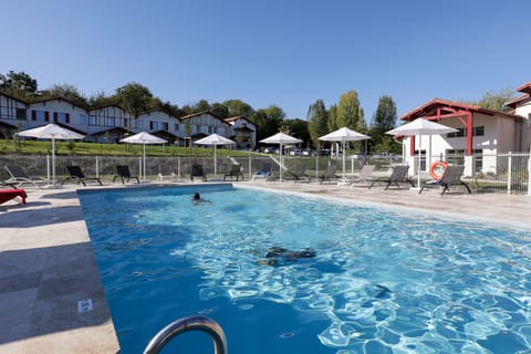 Unwind by the resort's spacious outdoor heated pool, open from April through September — the perfect spot to recharge between coastal adventures near Saint-Jean-de-Luz.