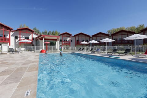 Soak up the Pyrenean sunshine from the poolside terrace, where shaded loungers and warm waters set the scene for a true southern French getaway.