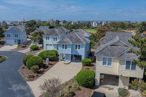 Charming coastal cottage with carport & porch chairs, steps to beach
