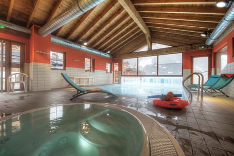 Soothe your muscles in the on-site hot tub after a powder day in winter or a long day of hiking and biking in summer Châtel.
