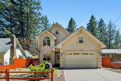 Charming mountain retreat nestled among towering pines, offering a peaceful escape with classic alpine architecture and natural beauty at every turn.