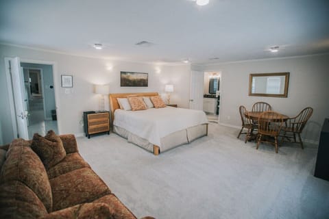 Primary bedroom has 2 seating areas, a smartTV, and ensuite bathroom