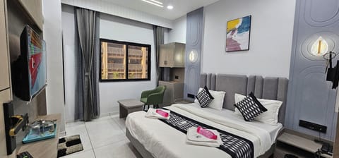 Deluxe Double Room, City View | In-room safe, desk, laptop workspace, iron/ironing board