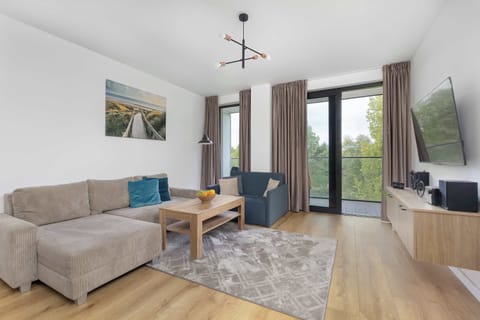 Elegant living room with comfortable seating and balcony access