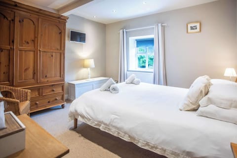 Sink into soft bedding after a day exploring the Yorkshire Dales, with calming neutral tones and a peaceful atmosphere designed for slow mornings and restful nights.