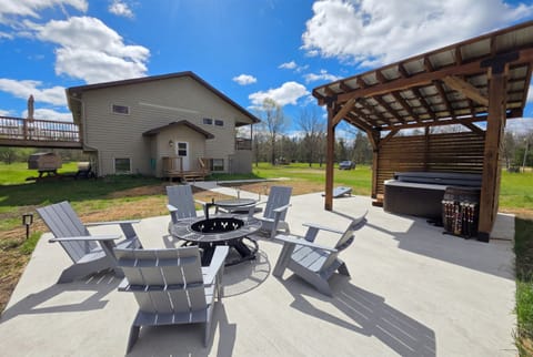 Patio with firepit and hot tub