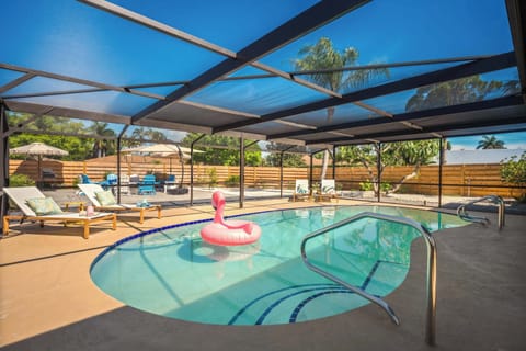 Dive into vacation mode in this sparkling screened-in pool oasis! Lounge under the shade, float the day away, or enjoy peaceful outdoor vibes with plenty of seating, sunshine, and privacy—perfect for relaxing family getaways.