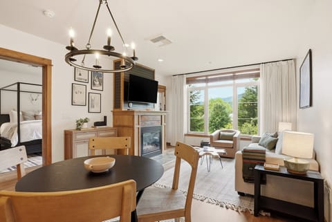 Bright living space with fireplace, dining area, and beautiful view