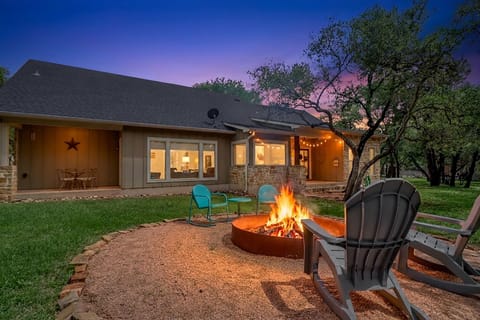 Gather around your private fire pit as twilight paints the sky in stunning purples and pinks, creating perfect moments for evening relaxation.