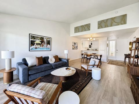 Settle into your bright, open-concept living space with cozy seating, modern touches, and a welcoming flow connecting to your fully equipped kitchen and dining area.