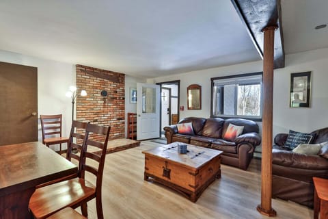 Gather on the leather seating or share a meal at the nearby dining table, all within one open room.