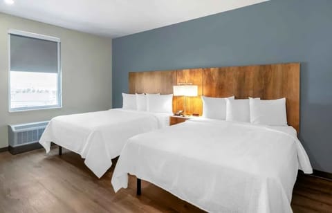 Unwind in crisp white linens after a long day.