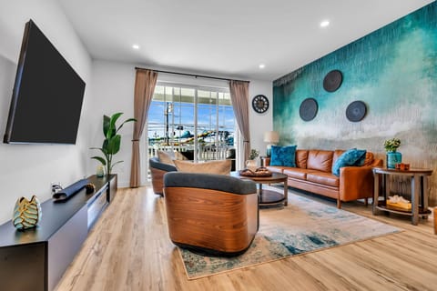 Bright designer living room with balcony views and cozy modern seating