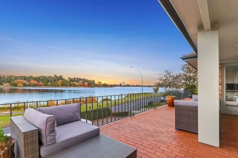 Watch your sunset paint the lake gold from your private waterfront deck—your perfect evening view starts here.