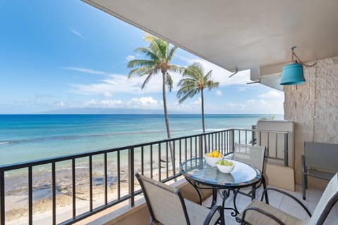 Take in sweeping coastline views from this private balcony with seating for two.