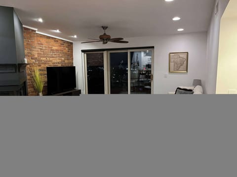 Curl up in the chic living room & stream your favorites on the smart TV​