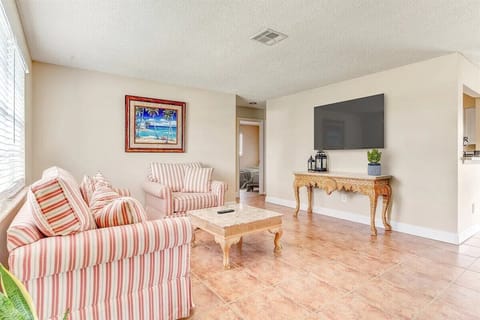 Grand living area with couch that can sleep one adult and large Internet tv.