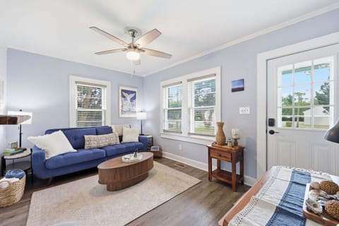 Bright and inviting living space with cozy seating and relaxing coastal cottage charm