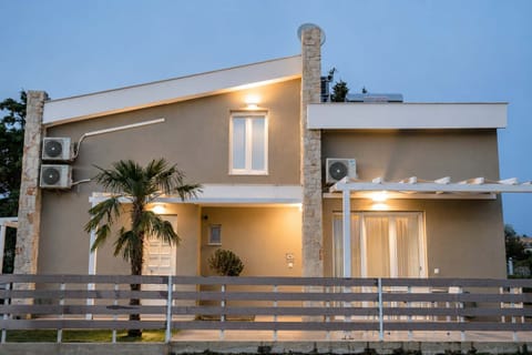 Modern exterior of the property and elegant evening lighting.