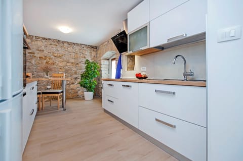 Villa | Private kitchen | Fridge, microwave, oven, stovetop