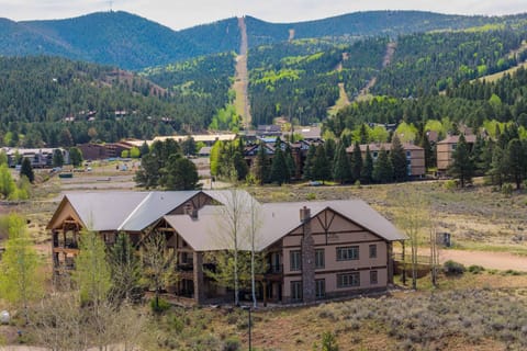 Angel Fire's ski runs rise right behind the lodge-style building