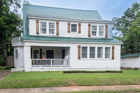 Welcome to Steel City Retreat! This classic two-story Birmingham home welcomes you with a spacious front yard, charming porch, and plenty of room inside for your whole group to settle in.