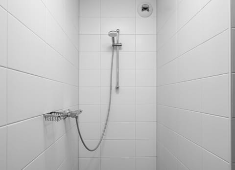 Shower, designer toiletries, hair dryer, towels