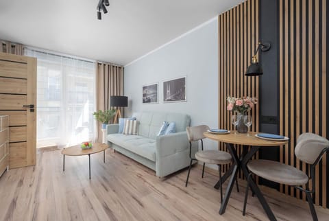 Bright living room with dining area, wooden accents