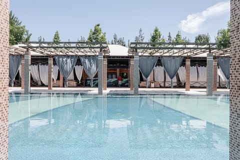 Seasonal outdoor pool, open 10:00 AM to 8:00 PM, free cabanas