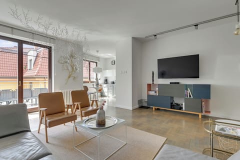 Family Apartment, Balcony, Courtyard View | Living area | 40-inch flat-screen TV with cable channels