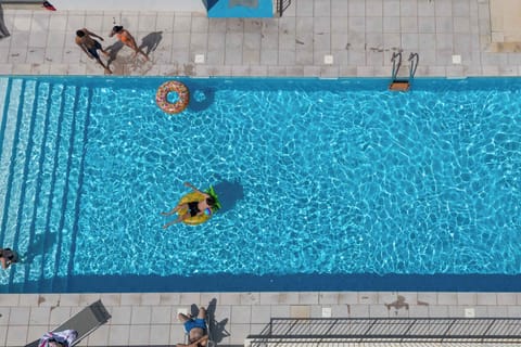 The outdoor heated pool, open from April to mid-September — one of two pools available to guests.