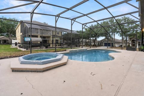 Private screened pool area with attached hot tub for relaxing outdoor enjoyment.