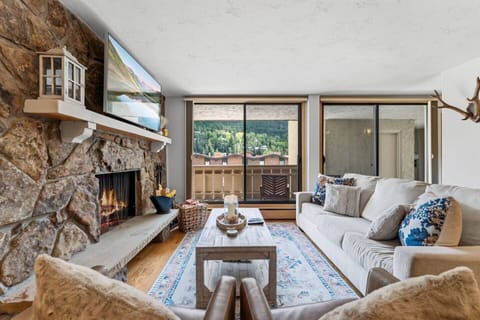 Cozy living room with fireplace and smart TV