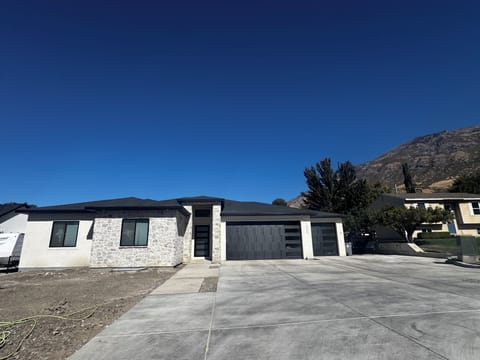 Apartment entrance is down the right side of house (garage side) on back of home