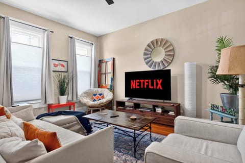 Living Room: Cozy living space designed for comfort, with plush seating, a large TV, and a welcoming atmosphere ideal for movie nights or quiet evenings.